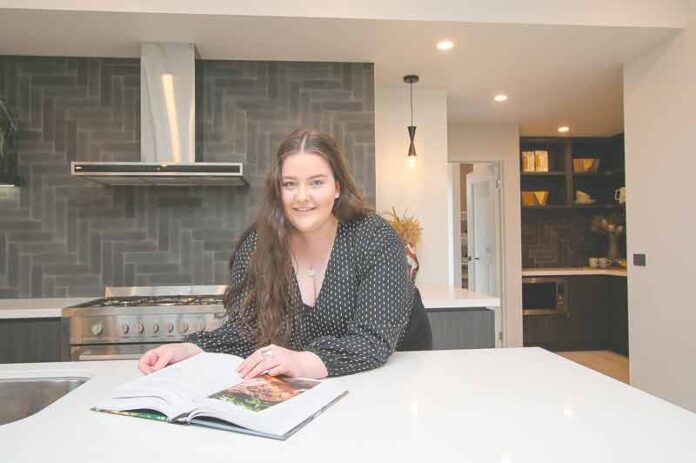 ADV---SIMMONDS-HOMES-1 DESIGN FROM HOME... Using an online tool, you can design your dream home. Pictured is Simonds Homes sales cadet, Sinead Simkin in one of the beautiful homes on display in Kialla. Photo: Kelly Lucas