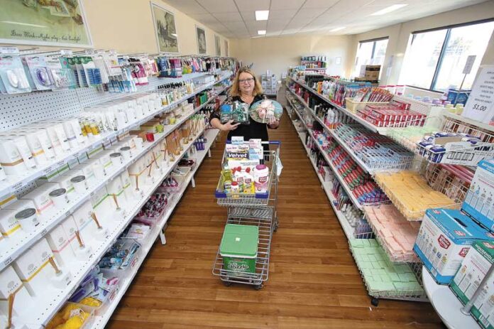 ED-PENTAL-1_01889 FILL UP YOUR TROLLEY... Pental Factory Sales manager, Lorraine Laffy with great hampers for gifts whether for corporate or personal. Photo: Kelly Lucas