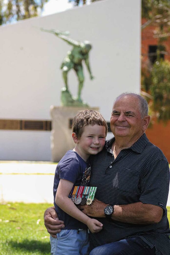 FP-RemembereranceDay_90661 PROUD of his pa... Nate Crosbie, 5, with his grandfather Shepparton RSL president, Bob Wilkie. Photo: Kelly Lucas