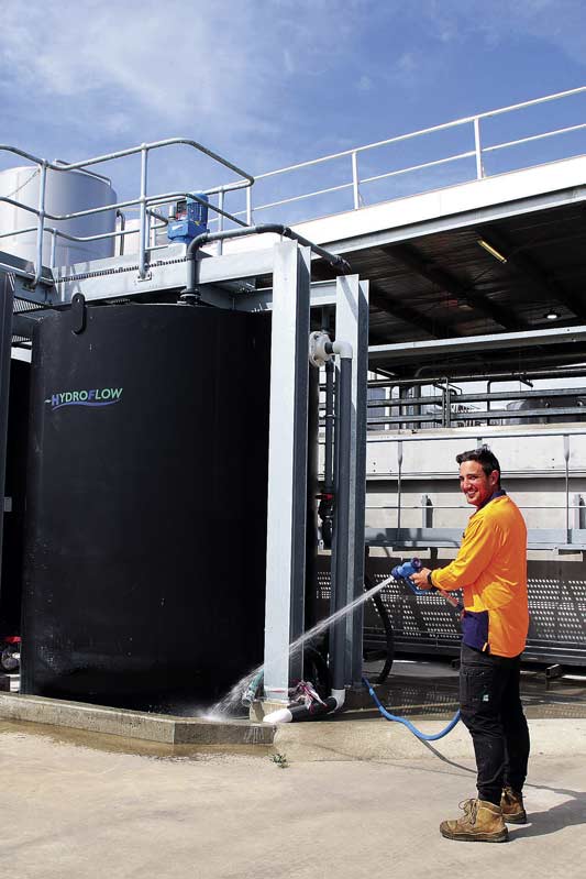 ED---HYDROFLOW-1 WORRY FREE WATER... Hydro Flow is good for the environment and great for business. Field service engineer, Ryan Sprunt is all smiles on site. Photo: Kelly Lucas.