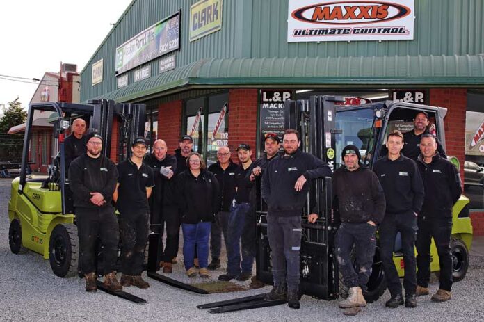 FLEETS AND FORKLIFTS... Available 24-hours a day, 7 days a week, meet from left, Joe, Ryan, Bailey, Pete, Darren, Jenny, Leigh, Jesse, Matt, Rob, Grant, Shane, Pat and Jarrod from L & P Mackin Forklifts. Photo: Kelly Lucas.