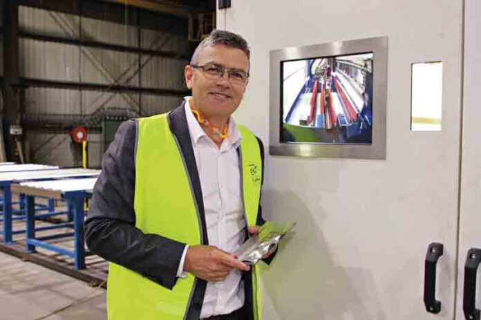 SHAPING OUR REGION’S HISTORY... J Furphy & Sons managing director, Adam Furphy, standing by a laser welding station. Photo: Steve Hutcheson