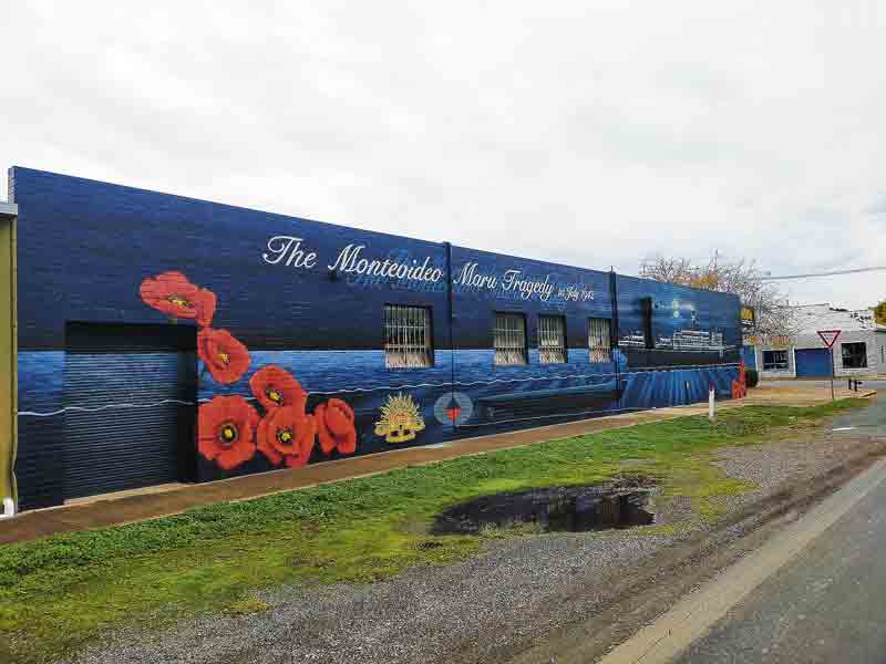 PAYING TRIBUTE... This mural pays tribute to the people who died as part of the sinking of the Montevideo Maru. Photo: Kelly Carmody