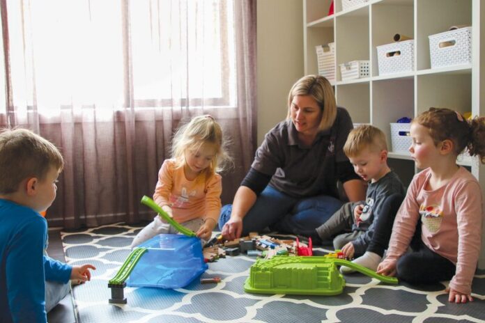 REGIONAL FAMILY DAY CARE EDUCATOR OF THE YEAR FOR THE THIRD TIME... educator Karen Eldred provides exceptional care for Blake Ennis, Ava Burns, Nash Wright and Gracie Bennett at Kanga Kids Family Day Care. Photo: Natasha Fujimoto