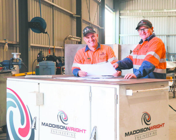 HUGE PROJECT... Pictured from left, Maddison Wright Engineering managing director Heath Wright with project manager/estimator Johno Gledhill looking over some of the Spirit of Tasmania’s new port plans. Photo: Kelly Carmody