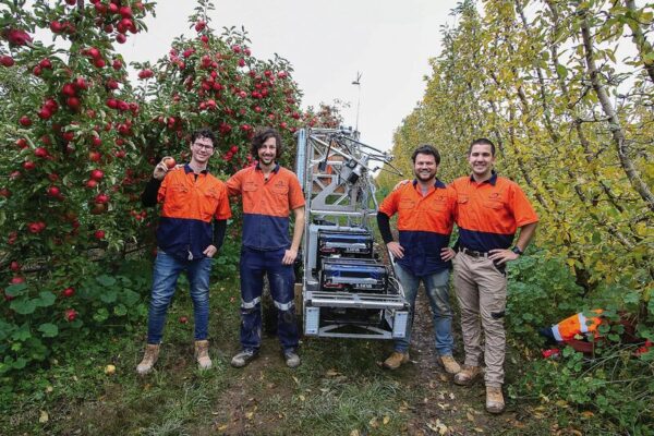PROUD OF PRODUCE INVENTION... Ripe Robotics co-founders Leopold Lucas and Hunter Jay, lead engineer Michael Wood and mechatronics engineer Tobin Smit with Eve Mk5 in the centre, on the day of their successful trial run at McNab & Sons orchards, Ardmona. Photo: Deanne Jeffers