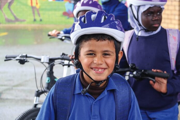 A GIFT THAT KEEPS GIVING... Variety Children's Charity recently donated 15 brand new bikes and equipment like locks and helmets to students at St George's Road Primary School. Pictured is student Omer Alali. Photo: Supplied