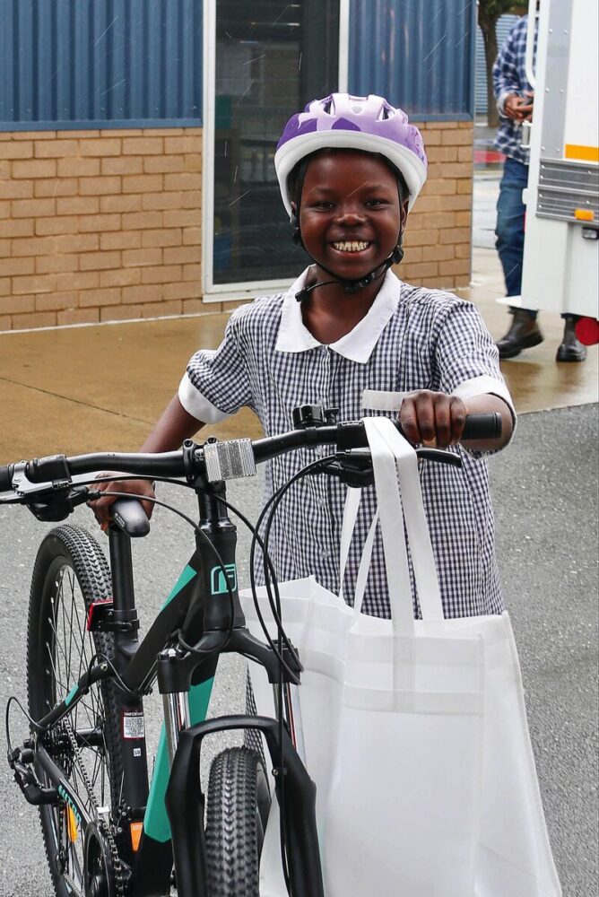 HAPPY DAYS... St George's Road Primary School student Shukrani Ngave pictured with her new bike and helmet, a gift from Variety Children's Charity to ensure all children have access to the fun and benefits of having their own bike. Photo: Supplied