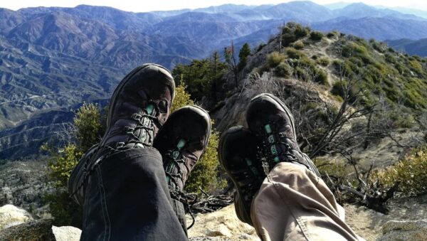 SO MANY OPTIONS... A speciality outdoor store can help advise on the most appropriate footwear for your needs and experience. Hiking boots and trail runners have several key differences that set them apart and each will suit different people and hikes better. Photo: Supplied